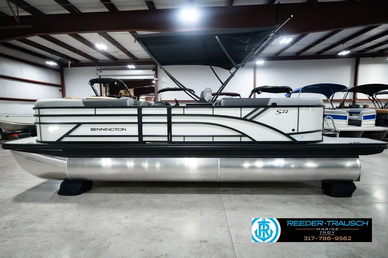 Slide: The Image of 2027 Bennington 22 SSR pontoon boat in showroom, side view with canopy. - 12
