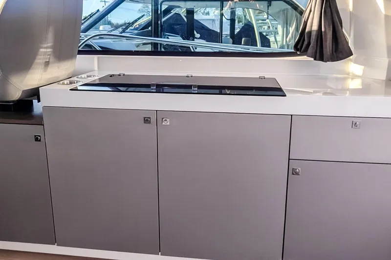 Slide: The Image of Modern kitchen area in a 2021 Beneteau America Antares 11 boat. - 7