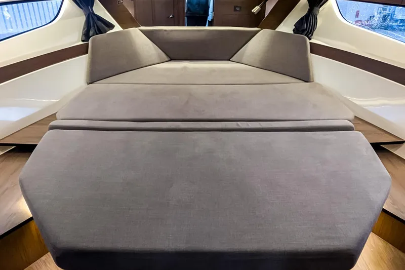 Slide: The Image of Interior view of 2021 Beneteau America Antares 11, featuring a spacious, comfortable bed. - 10