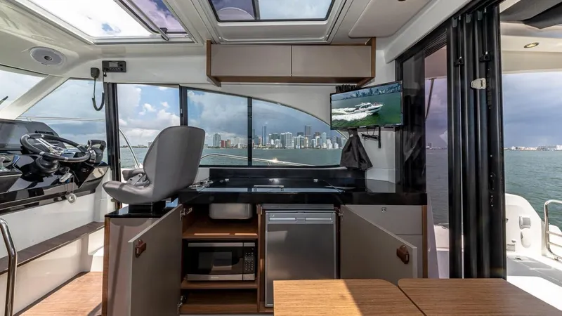 Slide: The Image of Interior of a Beneteau Antares 11 with modern kitchen and city view. - 20