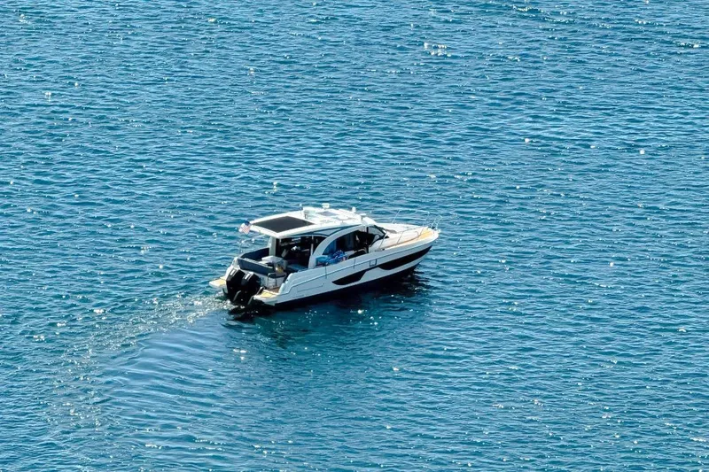 Slide: The Image of 2021 Beneteau America Antares 11 cruising on sparkling blue water. - 14