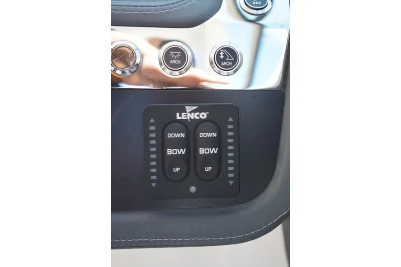 Slide: The Image of Control panel of 2025 Chaparral 270 OSX boat with Lenco trim tab switches. - 18