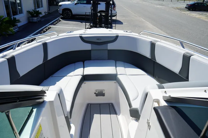 Slide: The Image of 2025 Chaparral 270 OSX boat interior with sleek seating and modern design. - 2