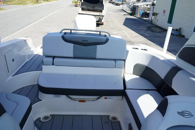 Slide: The Image of 2025 Chaparral 270 OSX boat interior with sleek seating and modern design. - 9