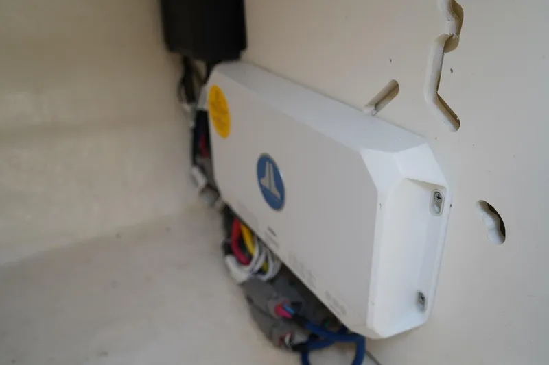 Slide: The Image of Electrical component inside 2025 Chaparral 270 OSX boat, featuring wiring and connections. - 17