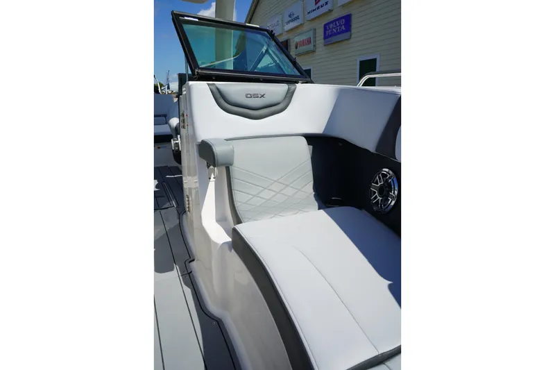 Slide: The Image of 2025 Chaparral 270 OSX boat interior with sleek seating and modern design. - 14