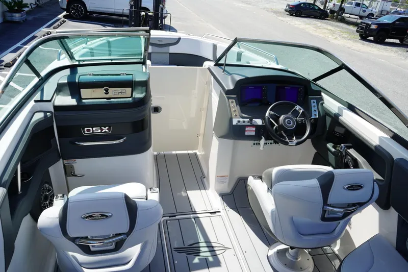 Slide: The Image of 2025 Chaparral 270 OSX boat interior with modern helm and seating. - 21