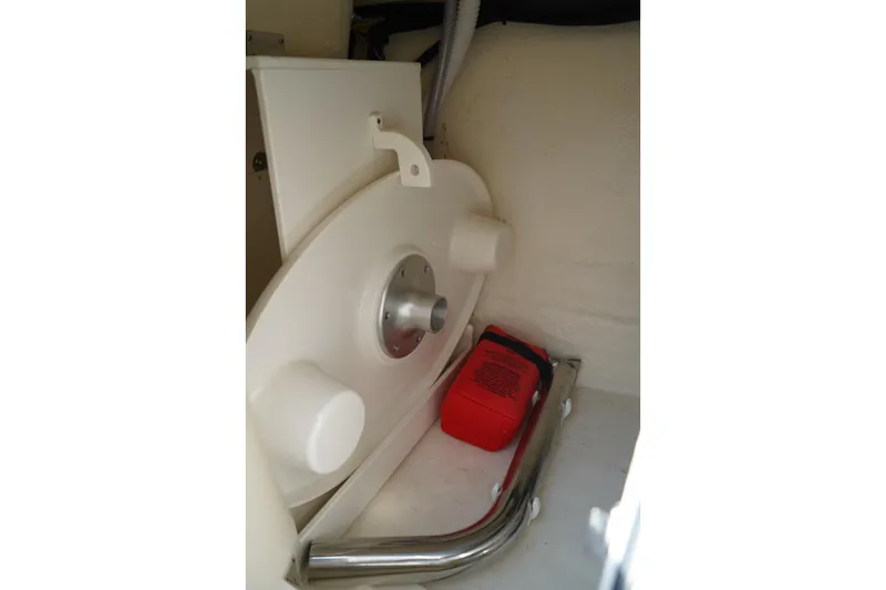 Slide: The Image of Interior view of 2025 Chaparral 270 OSX boat compartment with safety equipment. - 16