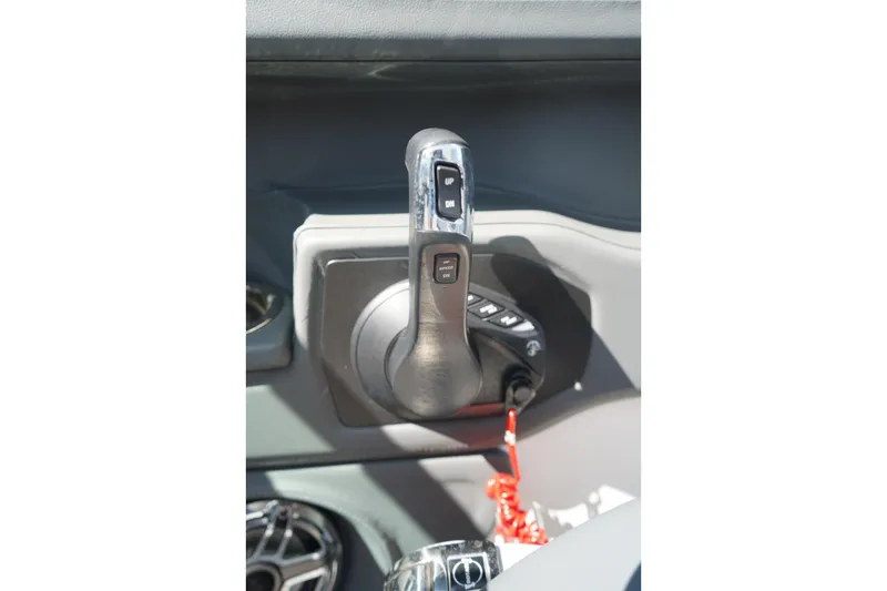Slide: The Image of Throttle control of 2025 Chaparral 270 OSX boat, featuring ergonomic design and controls. - 19