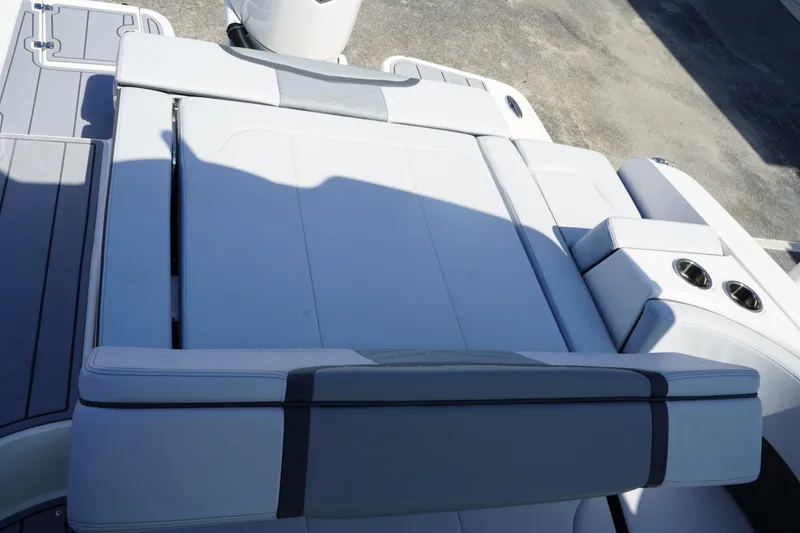 Slide: The Image of 2025 Chaparral 270 OSX boat interior with sleek seating and cup holders. - 20