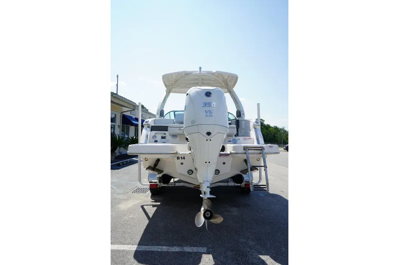Slide: The Image of Rear view of 2025 Chaparral 270 OSX boat with powerful outboard motor. - 22