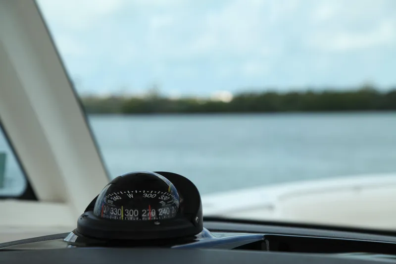 Slide: The Image of Compass on 2019 Boston Whaler 380 Outrage, overlooking calm waters. - 12