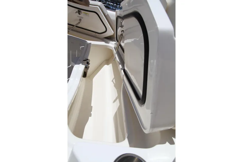 Slide: The Image of Storage compartment on a 2019 Boston Whaler 380 Outrage boat, open and empty. - 59