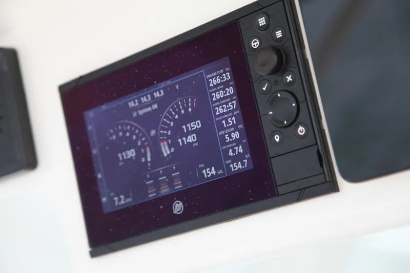 Slide: The Image of Dashboard display of a 2019 Boston Whaler 380 Outrage boat, showing engine metrics. - 13