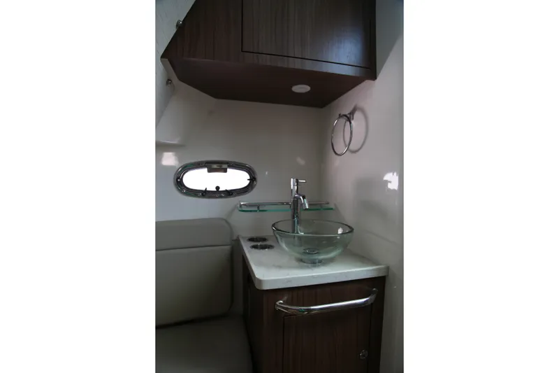 Slide: The Image of Interior of 2019 Boston Whaler 380 Outrage, featuring a modern sink and cabinetry. - 47
