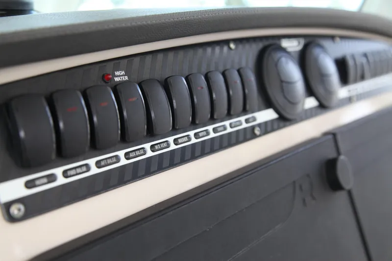 Slide: The Image of Control panel of a 2019 Boston Whaler 380 Outrage boat with labeled switches. - 7