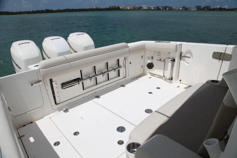 Slide: The Image of 2019 Boston Whaler 380 Outrage boat deck with seating and outboard motors. - 27