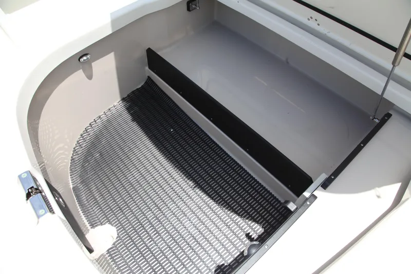 Slide: The Image of 2019 Boston Whaler 380 Outrage storage compartment with non-slip matting. - 63