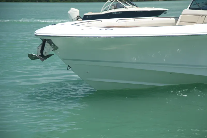 Slide: The Image of 2019 Boston Whaler 380 Outrage boat on turquoise water. - 44