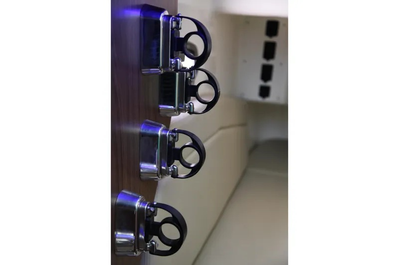 Slide: The Image of Stainless steel cup holders on 2019 Boston Whaler 380 Outrage boat interior. - 51