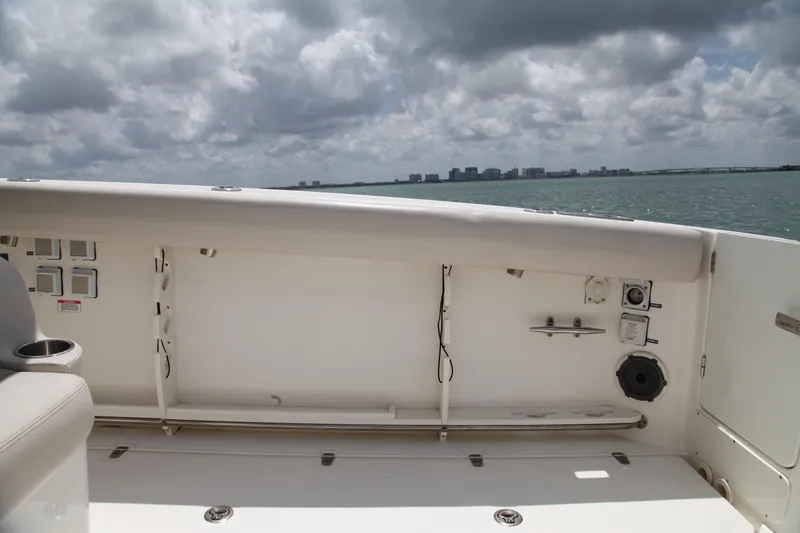 Slide: The Image of 2019 Boston Whaler 380 Outrage boat interior with ocean view and cloudy sky. - 23