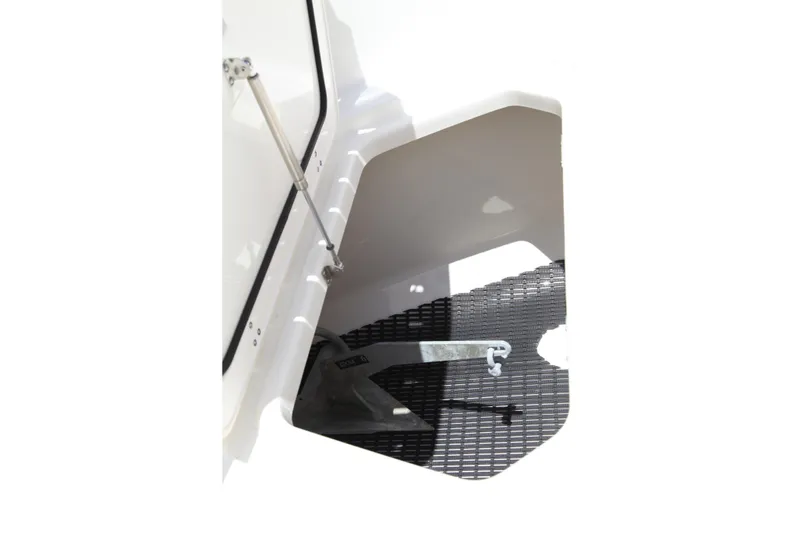 Slide: The Image of 2019 Boston Whaler 380 Outrage anchor compartment with stainless steel hardware. - 58