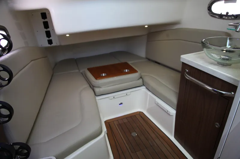 Slide: The Image of Luxurious interior cabin of 2019 Boston Whaler 380 Outrage with seating and wooden accents. - 50