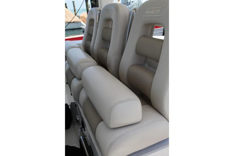 Slide: The Image of 2019 Boston Whaler 380 Outrage boat seats, featuring luxurious beige upholstery and ergonomic design. - 54