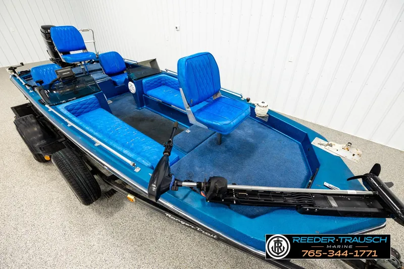 Slide: The Image of 1980 Ranger 175 VS boat with blue seating and trolling motor in showroom. - 7