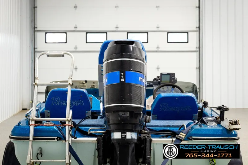Slide: The Image of 1980 Ranger 175 VS boat with Mercury outboard motor in a garage setting. - 5