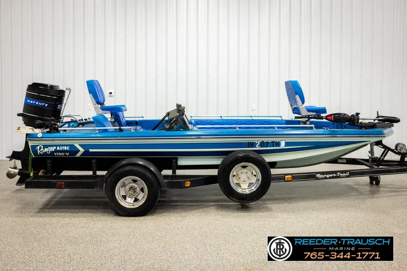 Slide: The Image of 1980 Ranger 175 VS boat with Mercury engine on trailer in showroom. - 3