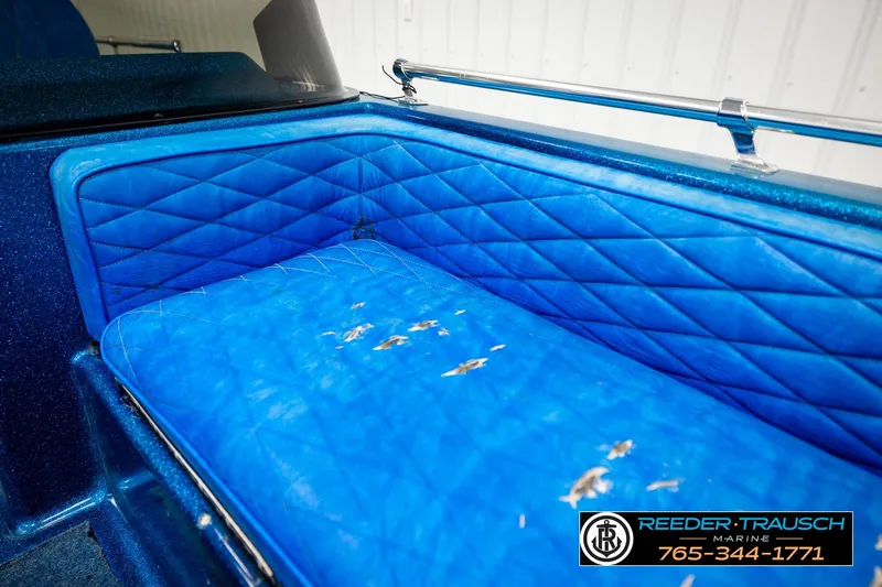 Slide: The Image of Blue quilted seat in a 1980 Ranger 175 VS boat, showing wear and tear. - 30