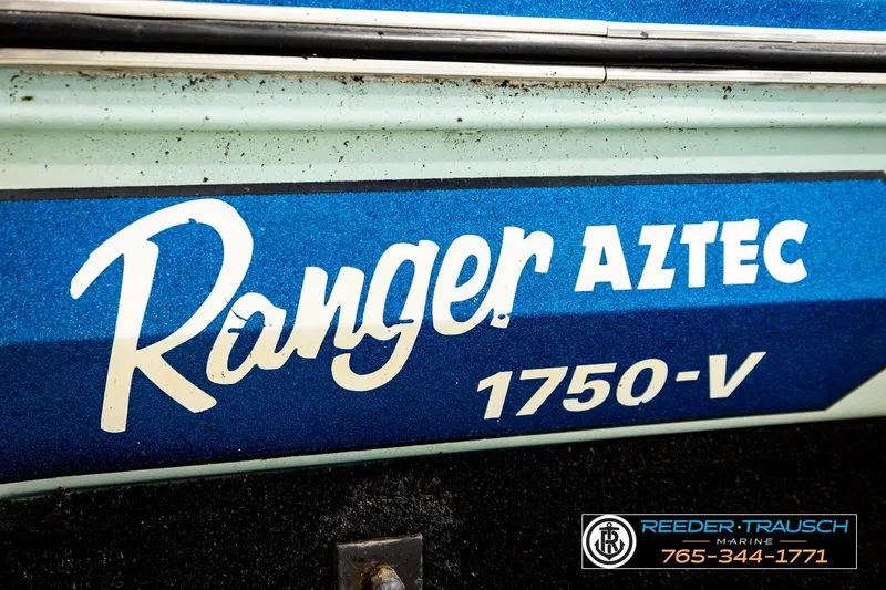 Slide: The Image of 1980 Ranger 175 VS boat with "Aztec 1750-V" branding, blue and white design. - 43