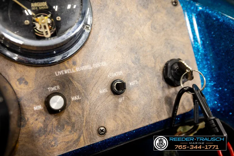 Slide: The Image of Control panel of a 1980 Ranger 175 VS boat with keys and switches. - 27