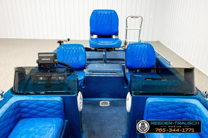 Slide: The Image of 1980 Ranger 175 VS boat interior with blue seating and Lowrance equipment. - 15