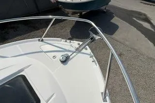 Slide: The Image of 2003 Edgewater 265 Express boat deck with stainless steel railing and anchor. - 25