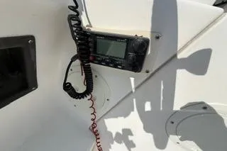 Slide: The Image of VHF radio installed on 2003 Edgewater 265 Express boat dashboard. - 19