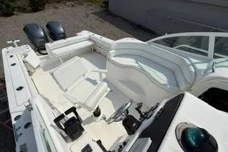Slide: The Image of 2003 Edgewater 265 Express boat interior with seating and dual engines. - 28