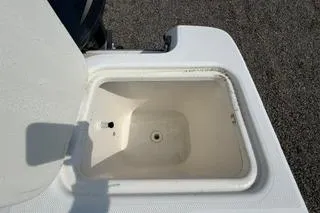Slide: The Image of Open storage compartment on 2003 Edgewater 265 Express boat. - 33