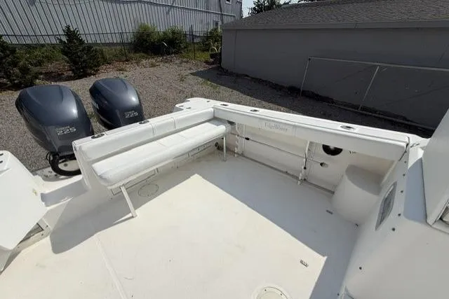 Slide: The Image of 2003 Edgewater 265 Express boat with twin engines and spacious deck seating. - 9