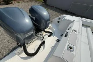 Slide: The Image of 2003 Edgewater 265 Express boat with dual Yamaha outboard engines. - 31
