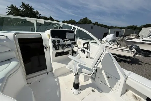 Slide: The Image of Helm of 2003 Edgewater 265 Express boat with steering wheel and controls. - 7