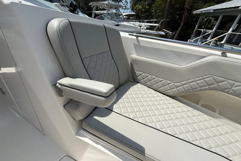 Slide: The Image of Luxurious seating on 2024 Pursuit DC 306 Dual Console boat with quilted upholstery. - 37
