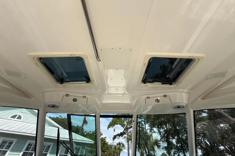 Slide: The Image of Interior view of 2024 Pursuit DC 306 Dual Console boat ceiling with skylights. - 20