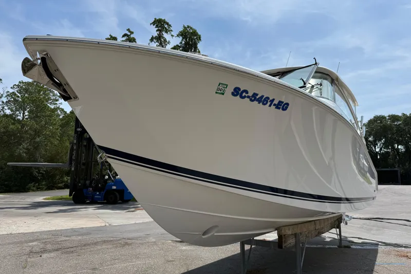 Slide: The Image of 2024 Pursuit DC 306 Dual Console boat on display, showcasing sleek design and modern features. - 6