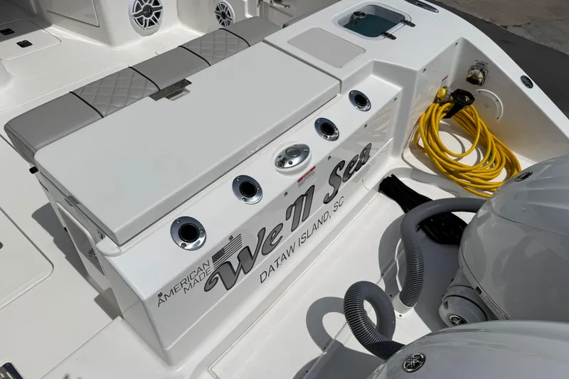 Slide: The Image of 2024 Pursuit DC 306 Dual Console boat with seating and fishing rod holders. - 40