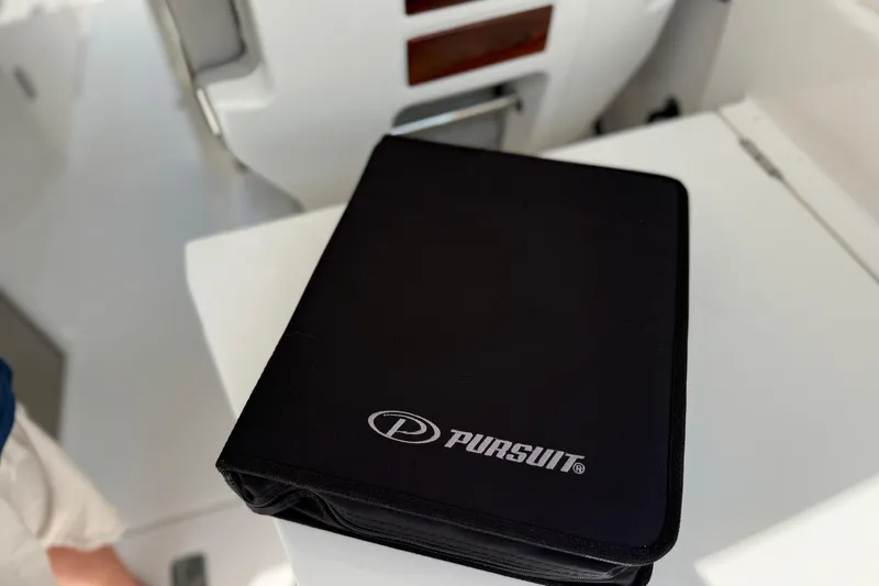 Slide: The Image of Black Pursuit folder on 2024 DC 306 Dual Console boat interior. - 46