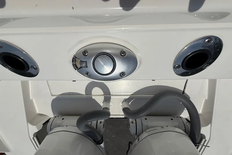 Slide: The Image of 2024 Pursuit DC 306 Dual Console boat detail with chrome fittings and hoses. - 41