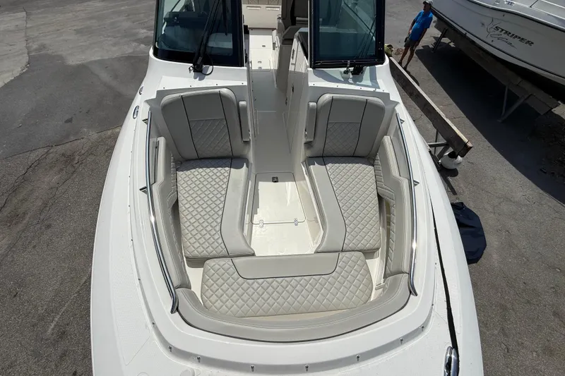 Slide: The Image of 2024 Pursuit DC 306 Dual Console boat with spacious seating and elegant design. - 35