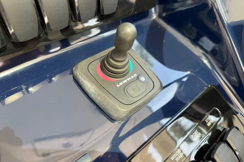 Slide: The Image of Joystick control on 2024 Pursuit DC 306 Dual Console boat dashboard. - 26